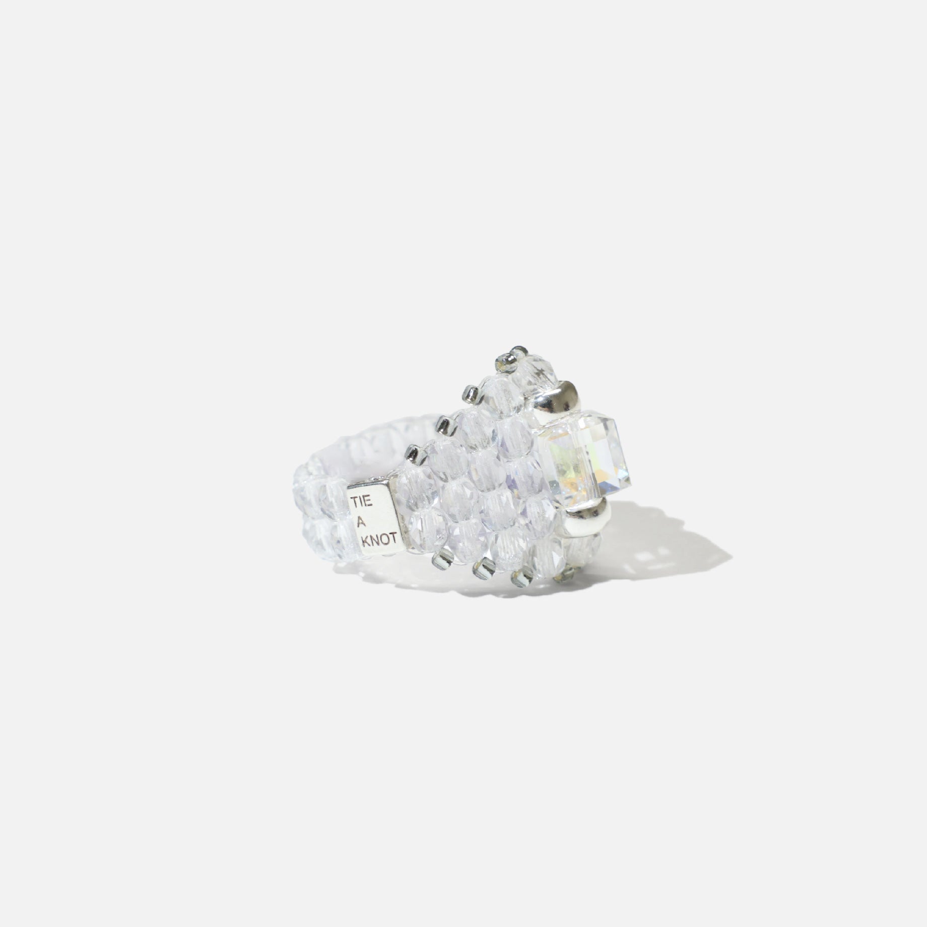 NEEDLES × TIE A KNOT SQUARE CRYSTAL BEADS RING (CLEAR)